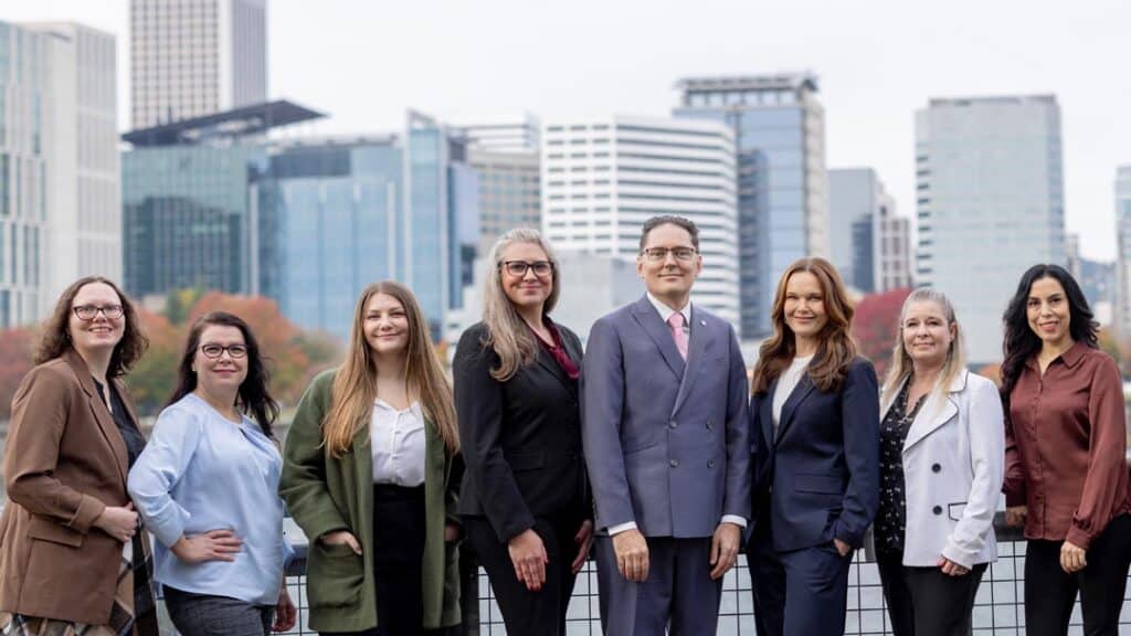 The Romano Law team in Portland Oregon in front of the Willamette River